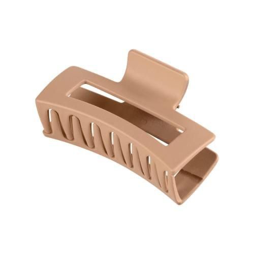 Beige hair clip on a white background