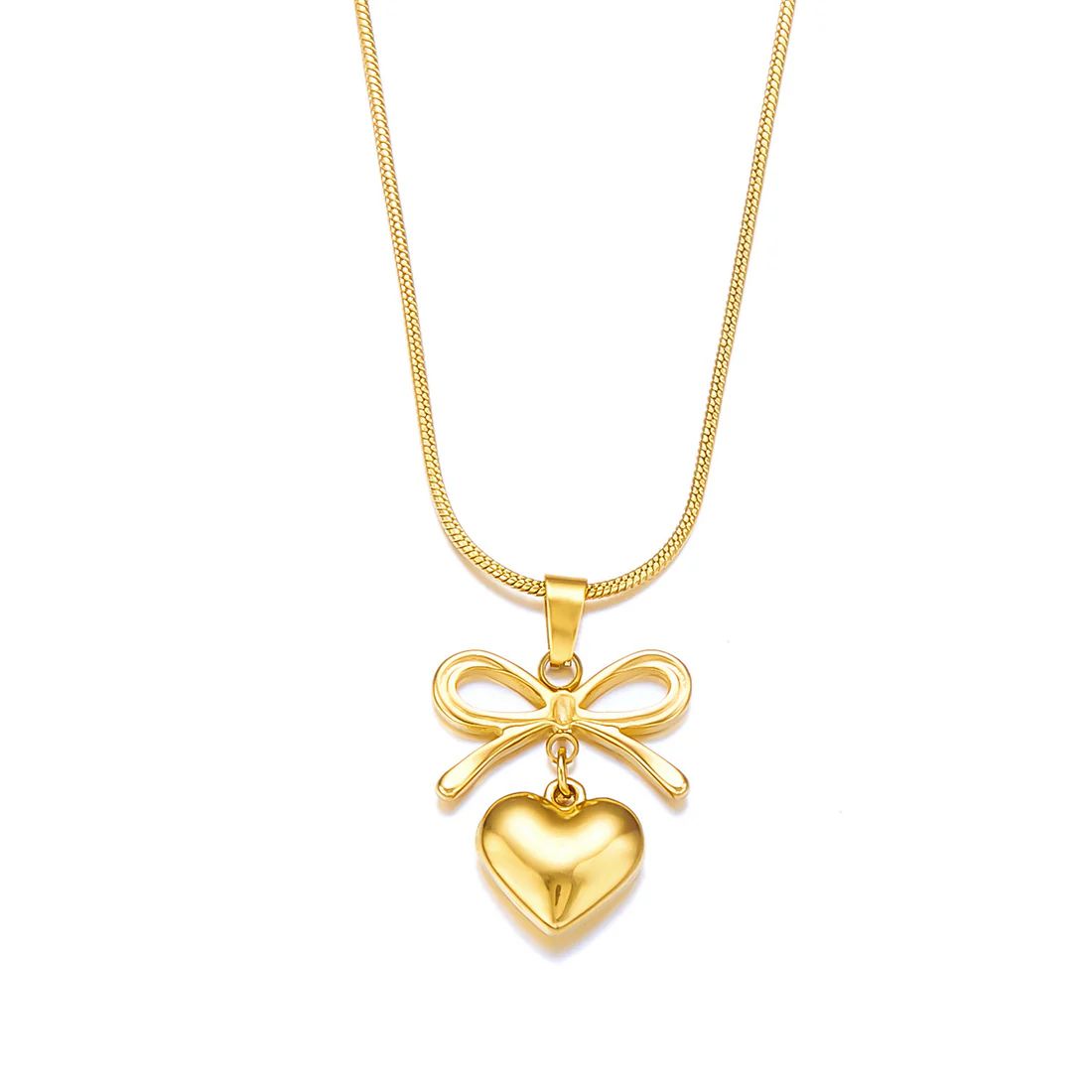 Gold necklace with a heart and bow pendant on a white background