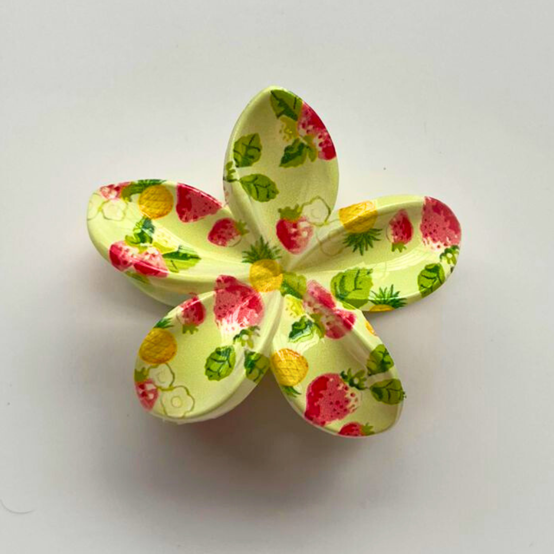 Floral-patterned butterfly-shaped object on a light gray background