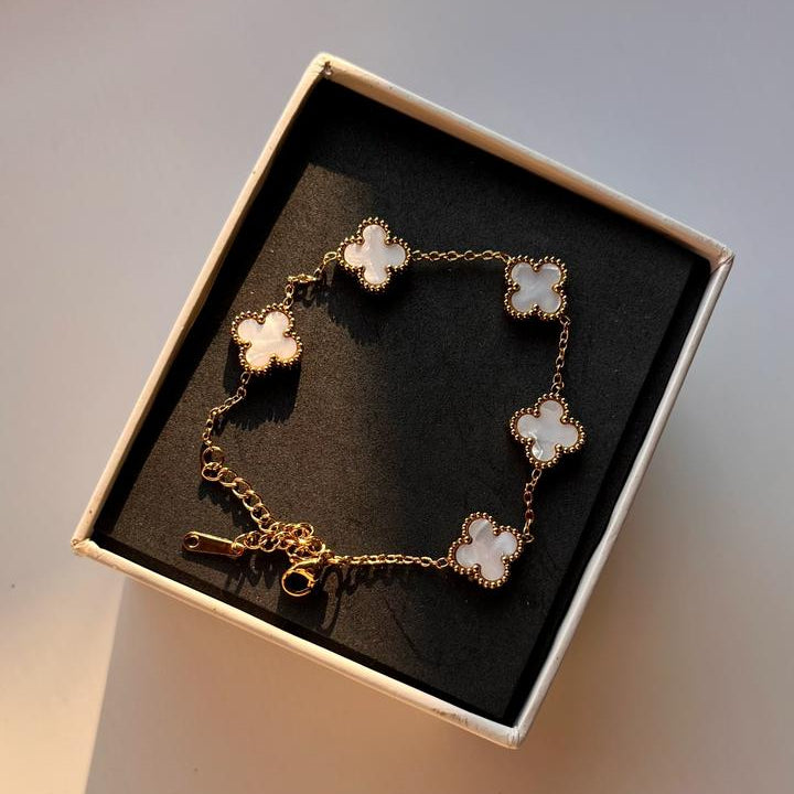 Bracelet with floral designs in a box on a light background