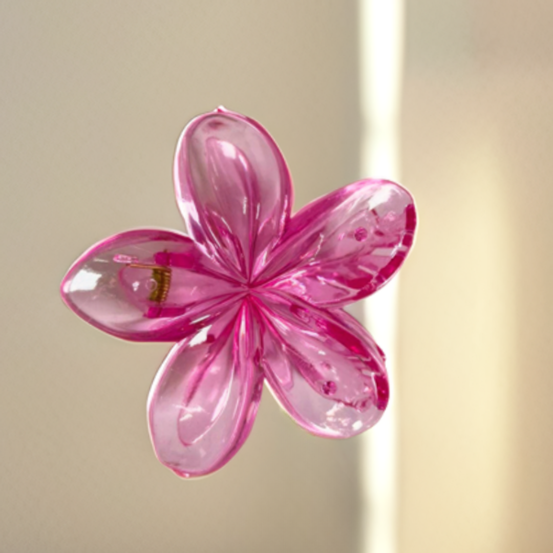 Pink glass flower on a beige background