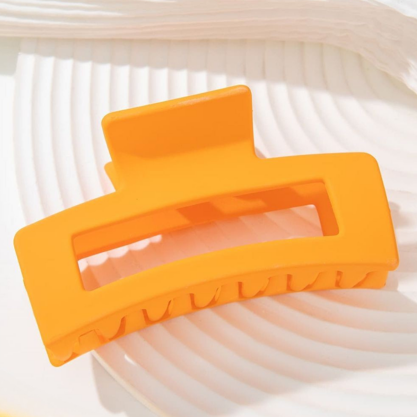 Orange clip on a white background