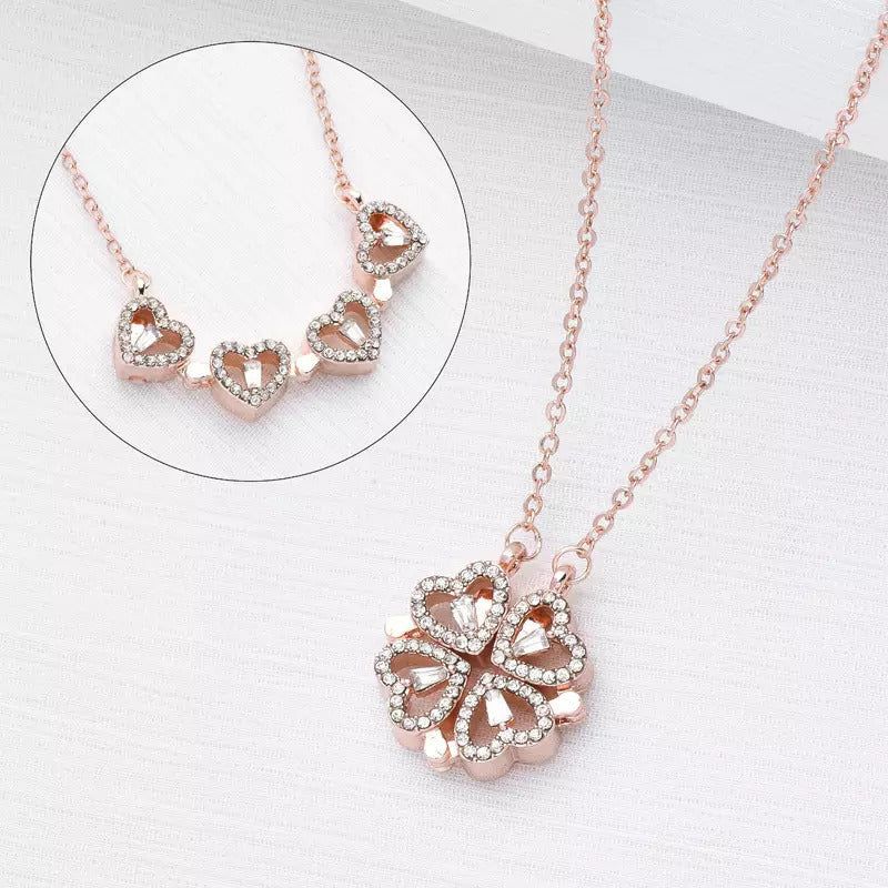 Rose gold necklace with heart-shaped pendant on a white background
