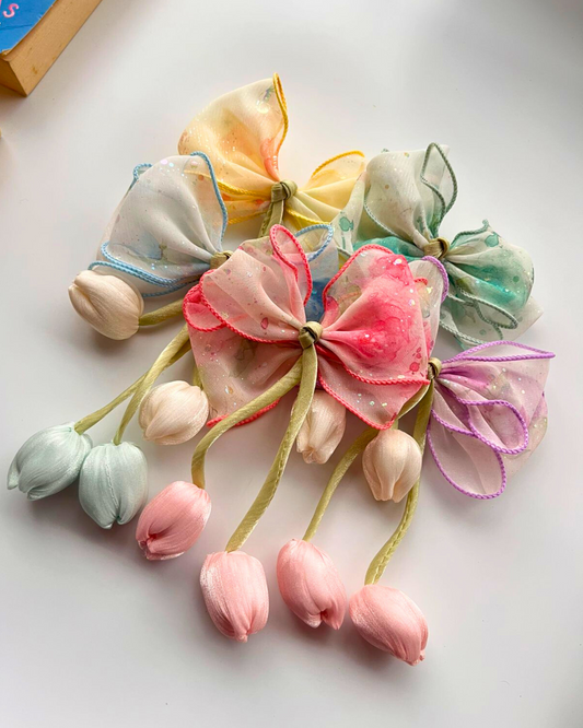 Colorful flower-shaped hair accessories on a white background