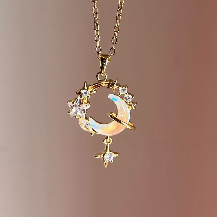 Gold necklace with a circular pendant on a gradient background
